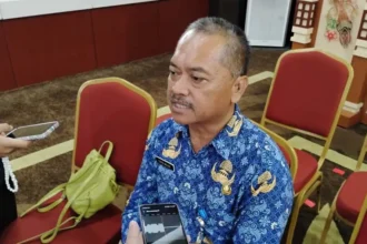 Kepala disnakertrans Kalimantan Tengah, Farid Wajdi phk karyawan hotel